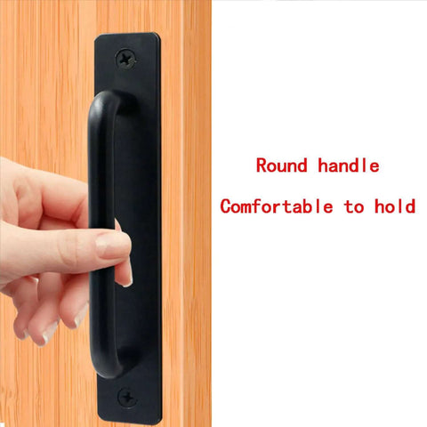 Hand holding black barn door handle from 8 Piece Metal Barn Door Pull Set With Flat Head Long Base Design For Barn Doors Drawers And Cabinets In Black Two Sizes For A Wide Range Of Indoor And Outdoor Uses Built Tough Durable Aluminum Alloy Rust Resistant.
