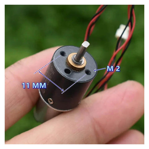 Close-up of 16mm Planetary Reduction Gearbox For DC Motors Electronic Starter in hand, showing shaft and wires, 11mm diameter.