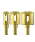 Heavy Duty Three Piece Diamond Drill Bit Hole Saw Kit For Smashing Through Ceramic Tile Granite Marble And Glass Bottles Without Breakage Plus Knockout Cutting Power Measures Two Fifth To Four Fifth Inches Wide, showing three diamond drill bits.