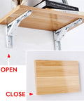 Slick Fold Away Corner Brackets For Wall Shelves And Tables Heavy Duty Support With No Sweat Screw Setup Straight Up Easy Hidden Triangle Mount White 14 Inch Pair with a wooden shelf.