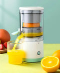 Handheld Citrus Juicer Electric For Oranges Lemons Limes USB Rechargeable Portable Squeezer Wireless Masticating Press with juice flowing into glass.