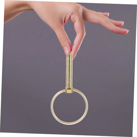 Hand holding 8 Pack Lynch Pin Kit Beefy Heavy Duty Ring Pins For Trucks Trailers Mowers And Farm Equipment Secure Fixes That Last Durable Wear-Resistant Spring-Loaded Design Built Tough For Real World Use.