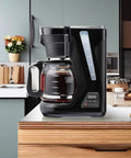 FrontFill Drip Coffee Maker Digital Programmable 12 Cup Glass Carafe Black And Silver With Easy Fill Reservoir And Swing Open Brew Basket For Space Saving Under Cabinet Kitchens in a modern kitchen