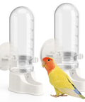 Hassle Free Automatic Bird Water Dispenser With Hanging Cage Mount For Parakeets Plus Small Flocks Featuring Leak Proof Self Refilling Trough And Zero Drama Leak Control In White Two Pack next to a colorful lovebird.