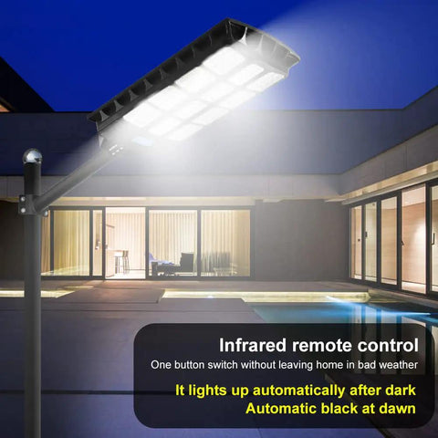 Ultra Bright Solar Street Light Outdoor Waterproof 80000LM Solar Powered Security Flood Light illuminating yard at night