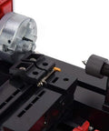 Close-up of Dope Little 24W 20000 RPM Mini Lathe Machine showing chuck and tool rest for wood, metal, and plastic turning.