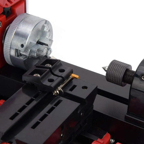 Close-up of Dope Little 24W 20000 RPM Mini Lathe Machine showing chuck and tool rest for wood, metal, and plastic turning.