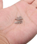 Sixteen Piece Nose Piercing Kit In 18G Surgical Steel With Top Flat, Top Ball, Clear Round CZ And Jeweled CZ Styles In 1.5mm, 2mm, 2.5mm, And 3mm Sizes, 6.5mm Pin Length, Ideal Nose Studs And Rings For Everyday Wear. 18G surgical steel nose studs on hand