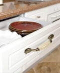 Open kitchen drawer showing Eight Piece Ceramic Drawer Handles Set In Chinese Style With Vintage Antique Design for cabinets.