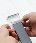 Application of Square Felt Furniture Pads 1 1/4 To 1 3/8 Inch Self Adhesive Floor Protectors on a chair leg.