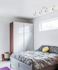 Bedroom with Dope Four Light Track Lighting Kit With Adjustable Heads And GU10 Sockets, 28 Inch Foldable Track System, white finish.