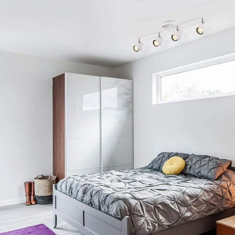 Bedroom with Dope Four Light Track Lighting Kit With Adjustable Heads And GU10 Sockets, 28 Inch Foldable Track System, white finish.