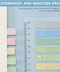 Sticky Book Tabs Set With Repositionable Book Markers, colorful PET flags with water droplets next to ruler and notebook