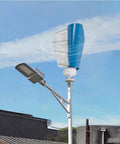 Dead Quiet 12V 3000W Outdoor Emergency Wind Turbine Kit With Controller installed on a pole, blue spiral blades under clear sky