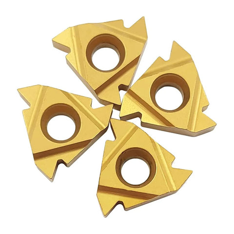 Four gold carbide turning inserts with center holes for CNC lathe threading.