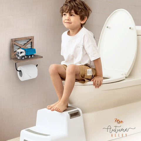 Child sitting on toilet with Rustic Farmhouse Toilet Paper Holder With Shelf For Wipes Wall Mounted Brown Wood