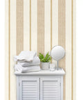 Rich Cream And Modern Gold Vinyl Wallcovering Boasts Subtle Leather Texture For Commercial Grade Heavy Duty Wear And Gets Custom Printed Just For You To Spark A Major Room Glow Up Today with towels and a plant.