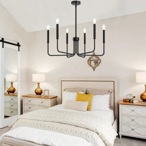Six Light Farmhouse Industrial Chandelier With Matte Black Finish in a bedroom setting