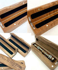 Wooden box with 90-degree bronze hinges holding a pen, showcasing durable zinc alloy hinges from 20 Pack Small Wooden Box Hinges With Screws.