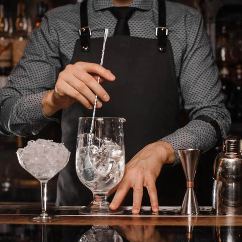 Bartender using Two Piece 12 Inch Stainless Steel Bar Spoon Set For Cocktails with Mirror Polished 18 8 Handle in mixing glass