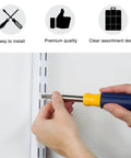 Using a screwdriver to install 230 Piece Drywall Anchors And Screws Kit With Plastic Wall Plugs in a white wall for easy mount
