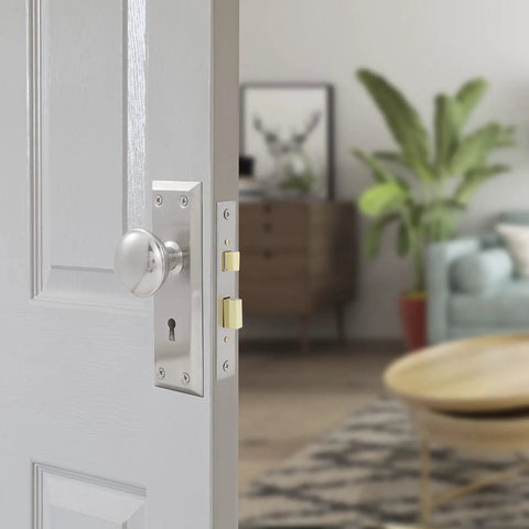 Three Pack Mortise Lock Set For Interior Doors With Privacy Lock And Skeleton Key Old School Style Door Knobs In Brushed Nickel Finish on open door