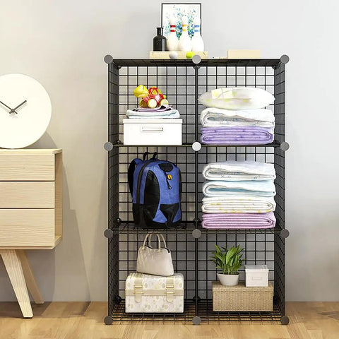 Six Cube Storage Organizer Set With Stackable Wire Grid Shelves Beefy Metal Cubes For Home Office And Kids Room Each Cube Holds Up To 22 Lbs 12 Inch Square DIY Closet Organizer In Black Space Saving And Easy To Tidy filled with bags, towels, and decor items against a light wall.