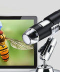 HD 1600x Magnification USB Digital Microscope With LED Light for Home Use, showing a close-up of an insect on screen, U-shaped stand