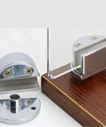 Set of 2 Frameless Glass Cabinet Door Hinges for Bathrooms, Clamp Style, displayed on wooden surface