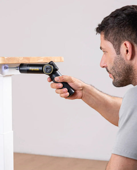 High Performance Pivot Handle Electric Screwdriver Featuring Live Torque Display And Eight Adjustable Settings For Hustle Ready Tech Repairs And Smooth Jobs in use on furniture.