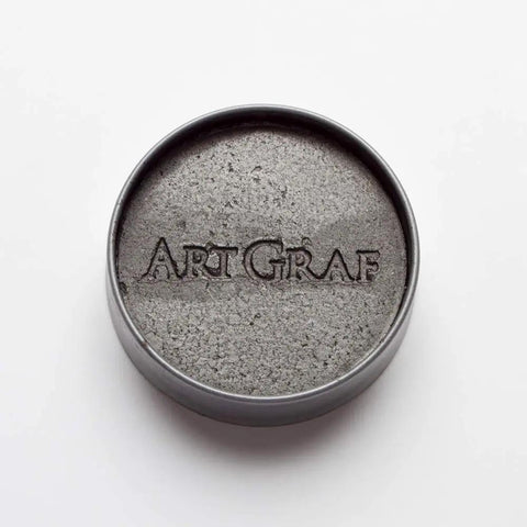 Water Soluble Graphite In A 20g Grey Tin For Wet Or Dry Sketching, portable artist grade graphite shown in a round tin.