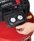 Close-up of Oil Free 6 Gallon Pancake Air Compressor With 150 Psi Max, adjustment knob and gauges visible, Made In USA.