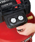 Close-up of the Workhorse Pancake Air Compressor With Six Gallon Oil Free Tank 150 PSI Max Pressure pressure dials and controls.