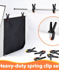 Hella Durable Plastic Spring Clamps 18 Pack 3.5 Inch Black Grip Clips on backdrop setup for photography lighting.