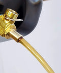 FN-Series Engine Oil Drain Valve With LC-10 Lever Clip in use, showing tool-free operation for cars and light trucks