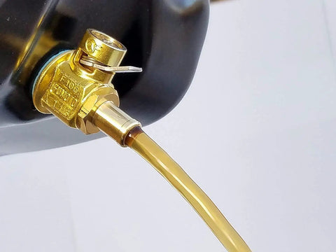 FN-Series Engine Oil Drain Valve With LC-10 Lever Clip in use, showing tool-free operation for cars and light trucks