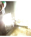 JUDYSSY Courtyard Light Led Solar Flood Light Outdoor being splashed with water to demonstrate IP66 waterproof feature.