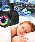 Super Quiet 10W Submersible Fountain Pump with 160 GPH Flow and 12 LED Lights next to sleeping woman