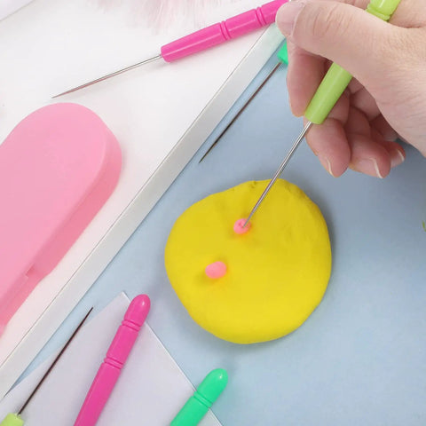 Person using Six Piece Cookie Scribe Tool Set Featuring Durable Iron Pins And Comfortable Plastic Handles For Flawless Sugar Cookie Decorating and Sweet Baker Crafts That Are Total Game Changers on yellow dough.