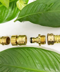 Lead Free Brass Garden Hose Quick Connect Fittings Three Quarters Inch GHT Durable Water Hose Connectors Two Pack No Lead Safe Drinking Quality For Tough Outdoor Use shown disassembled in garden setting.