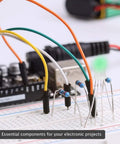 Resistor kit components on breadboard with assorted axial resistors and a green LED