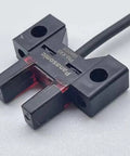 Dual Output NPN Photoelectric Switch Sensor PM K45 With Normally Open And Normally Closed Modes, front view of black sensor unit