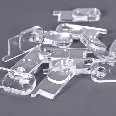 Clear Toggle Switch Plate Guards 10 Pack for Indoor and Outdoor Wall Plates Keeps Switches From Getting Flipped On Or Off piled on surface