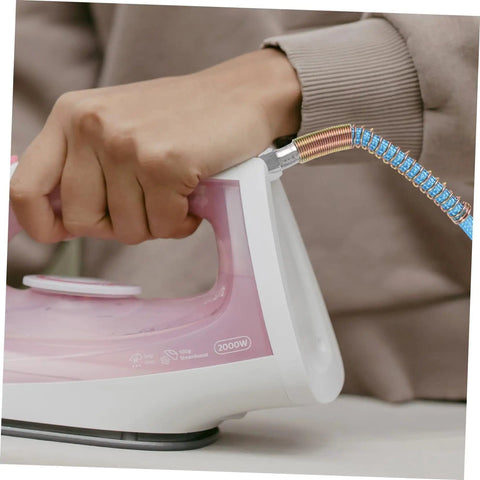High Temperature PTFE Steam Hose For Irons And Steam Cleaners Lightweight And Easy Install Replacement Flexible Durable Hose With Wide Fittings For Steam Ironing And Cleaning attached to pink iron