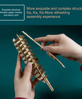 Hands assembling 3D Wooden Steampunk Spaceship Puzzle Kit For Adults With Mortise Tenon Joinery, detailed bamboo structure