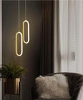 UIOLCFF Classic Modern Simple Gold Aluminum Pendant Light LED 18W Three Color Dimmable Hanging Lamp Bedroom Living Room in cozy setting.