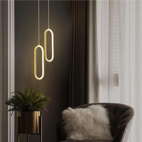 UIOLCFF Classic Modern Simple Gold Aluminum Pendant Light LED 18W Three Color Dimmable Hanging Lamp Bedroom Living Room in cozy setting.