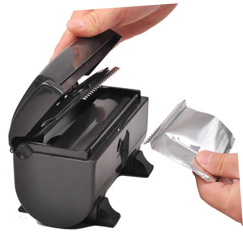 User demonstrates Tin Foil Cutter Machine With Automatic Storage Box For Hairdressing And Nail Art Supplies High Temperature Resistant Foil Dispenser For Barbershop And Salon Use Built Tough With Durable Steel Cutter And Smooth Glide