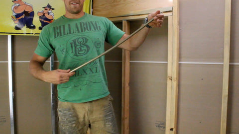 Man demonstrating Rack-A-Tiers Pipe Viper Cold Bend Tool for Half Inch Schedule 40 PVC Conduit Bender.