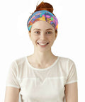 Flex Your Outdoor Setup With This Ultra Breezy Stretchy Neck Gaiter. Colorful headband worn by smiling woman in a white shirt.